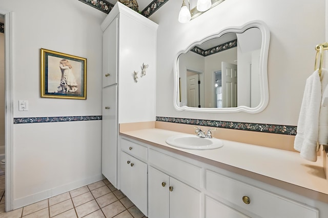 bathroom featuring tile patterned flooring and vanity