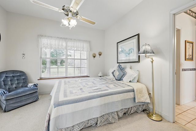 bedroom with carpet floors, ceiling fan, and baseboards