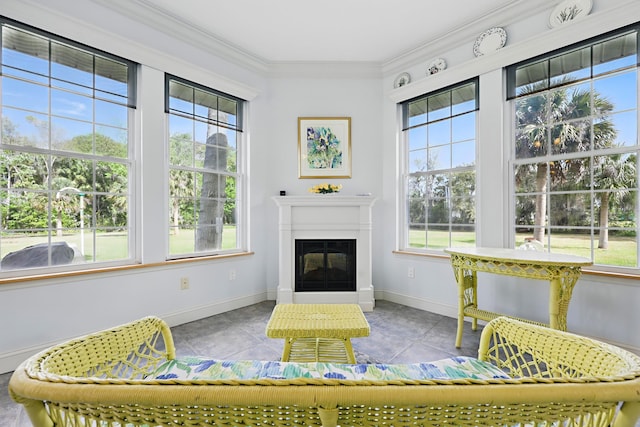 sunroom with a glass covered fireplace