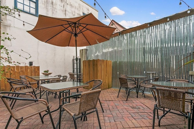 47 Cordova St, Saint Augustine, FL 32084 - view of patio / terrace featuring fence and outdoor dining area