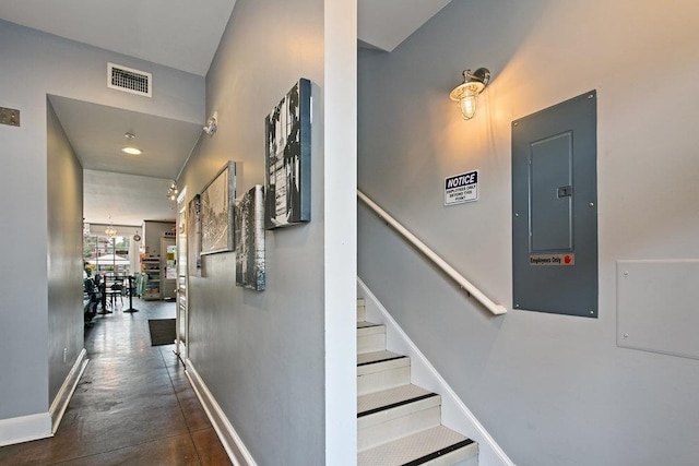 47 Cordova St, Saint Augustine, FL 32084 - stairs with baseboards, visible vents, concrete floors, and electric panel