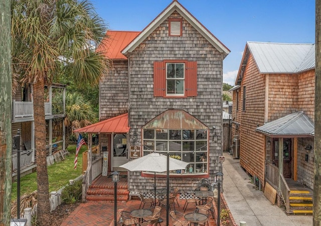 47 Cordova St, Saint Augustine, FL 32084 - back of house with a patio area, metal roof, and a standing seam roof