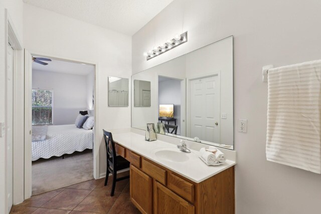 bathroom featuring vanity, tile patterned floors, and ceiling fan