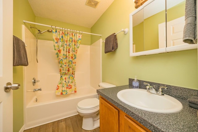 232 Riberia St, Saint Augustine, FL 32084 - full bath with shower / tub combo, toilet, visible vents, vanity, and wood finished floors