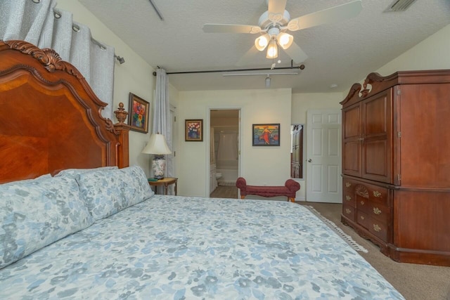 232 Riberia St, Saint Augustine, FL 32084 - carpeted bedroom featuring connected bathroom, a ceiling fan, rail lighting, a textured ceiling, and visible vents