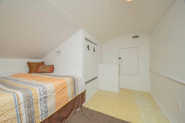 232 Riberia St, Saint Augustine, FL 32084 - bedroom with lofted ceiling, baseboards, and visible vents