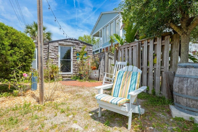 232 Riberia St, Saint Augustine, FL 32084 - view of yard with an outbuilding, a shed, and fence