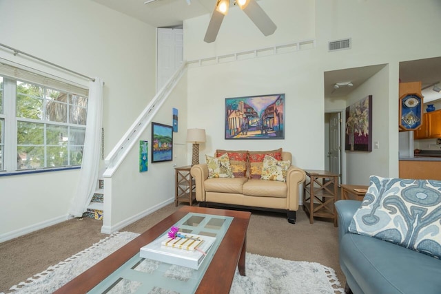 232 Riberia St, Saint Augustine, FL 32084 - living room with ceiling fan, a high ceiling, carpet floors, and visible vents