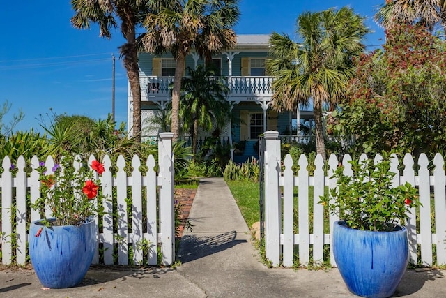 232 Riberia St, Saint Augustine, FL 32084 - view of front facade with a balcony and a fenced front yard