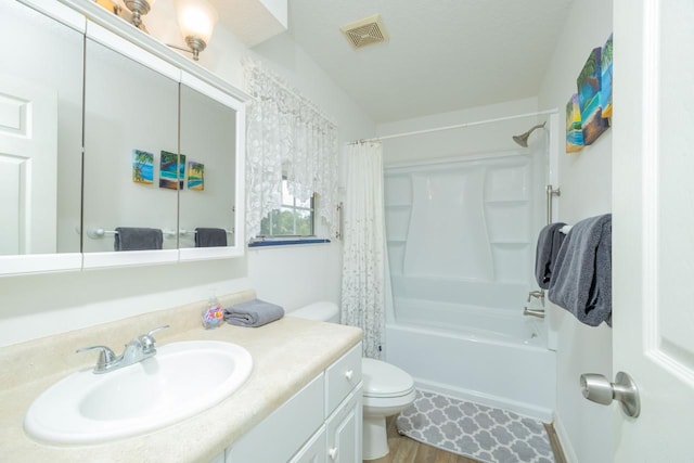 232 Riberia St, Saint Augustine, FL 32084 - bathroom featuring toilet, shower / tub combo with curtain, visible vents, vanity, and wood finished floors