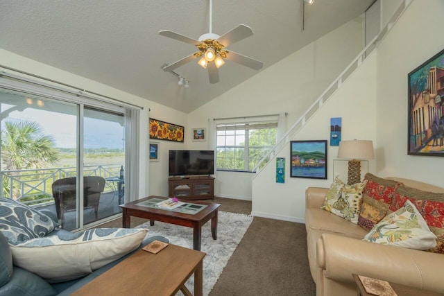 232 Riberia St, Saint Augustine, FL 32084 - living room featuring a ceiling fan, baseboards, carpet floors, and vaulted ceiling