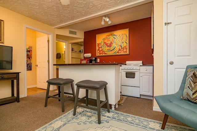 232 Riberia St, Saint Augustine, FL 32084 - bar with carpet, white range with electric cooktop, bar, visible vents, and baseboards
