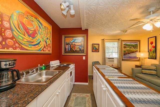 232 Riberia St, Saint Augustine, FL 32084 - kitchen featuring baseboards, ceiling fan, a sink, white range with electric cooktop, and light carpet