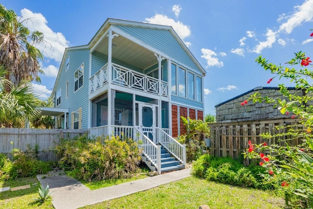 232 Riberia St, Saint Augustine, FL 32084 - rear view of property featuring fence and a balcony
