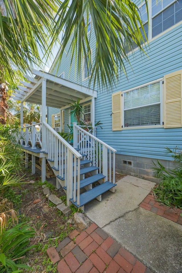 232 Riberia St, Saint Augustine, FL 32084 - property entrance featuring a pergola and crawl space