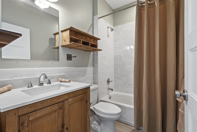 full bathroom with vanity, toilet, shower / bathtub combination with curtain, and tile walls