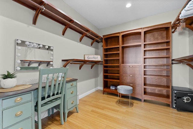 home office featuring baseboards and light wood-style flooring