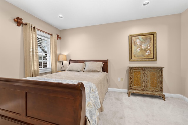 bedroom featuring baseboards, light colored carpet, and recessed lighting