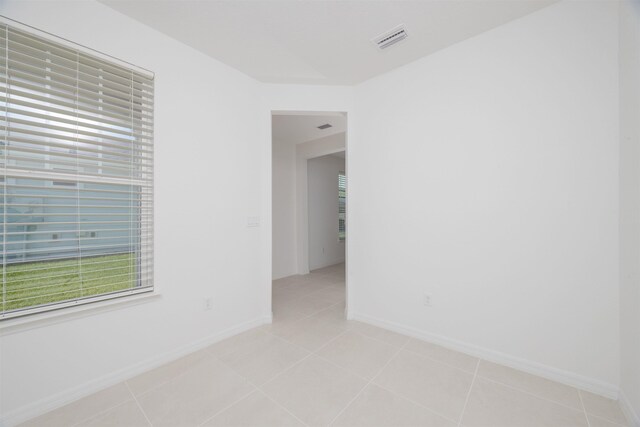 166 Fairlake Cir, Saint Augustine, FL 32092 - spare room featuring baseboards and light tile patterned floors