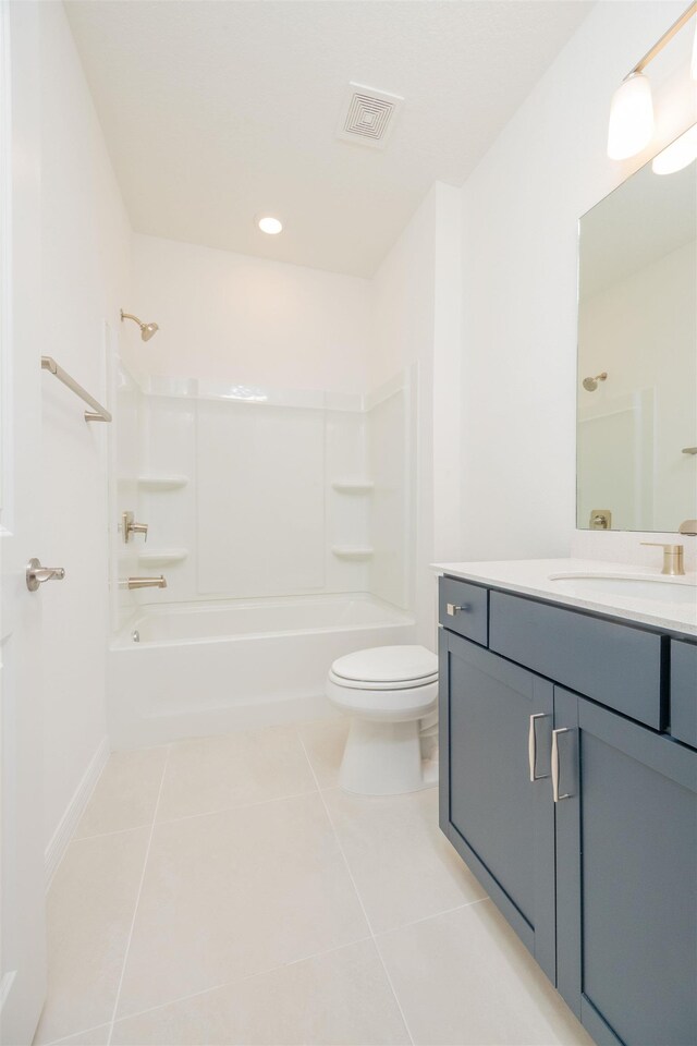 166 Fairlake Cir, Saint Augustine, FL 32092 - full bathroom with tile patterned floors, toilet, vanity, shower / washtub combination, and baseboards