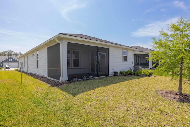 166 Fairlake Cir, Saint Augustine, FL 32092 - rear view of house featuring a sunroom, central AC, and a yard