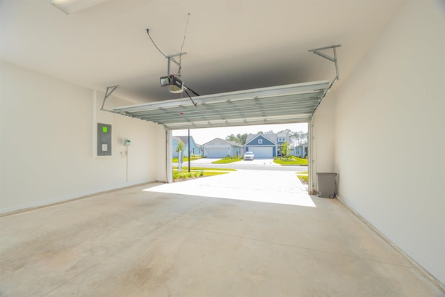 166 Fairlake Cir, Saint Augustine, FL 32092 - garage featuring a garage door opener, electric panel, a residential view, and baseboards