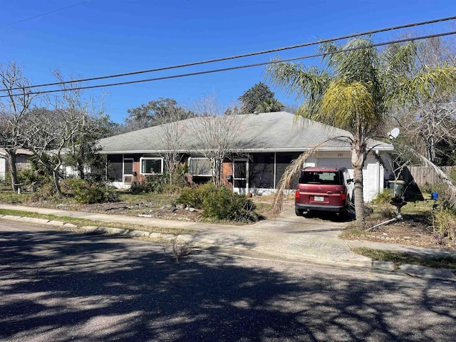 view of front facade featuring driveway and an attached garage