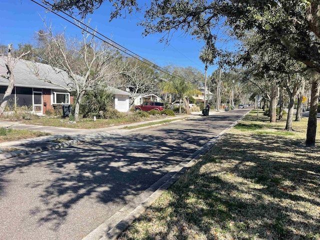 view of street with curbs