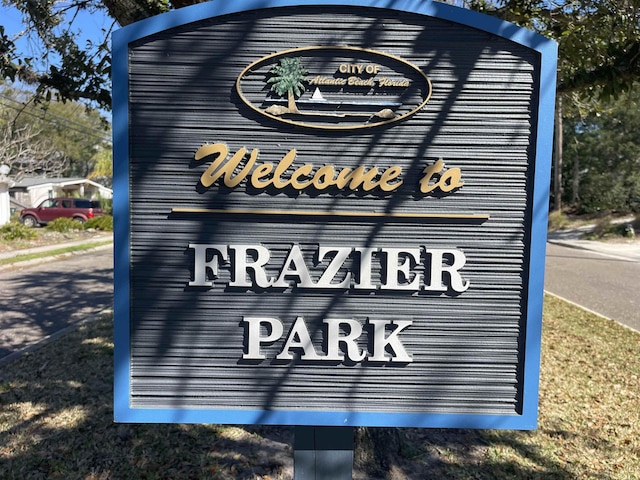 community / neighborhood sign featuring a garage