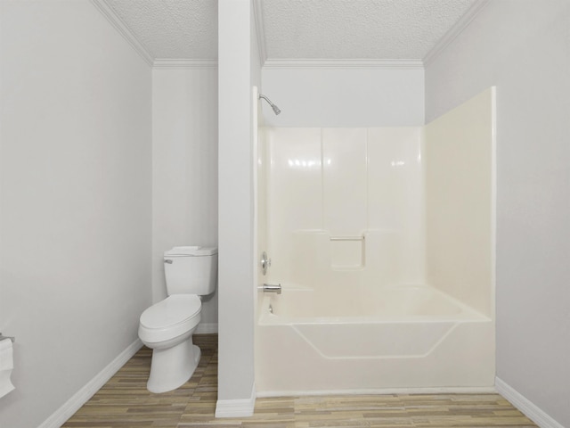 50 Spring St, Saint Augustine, FL 32084 - full bathroom with a textured ceiling, wood finished floors, crown molding, and shower / bathtub combination