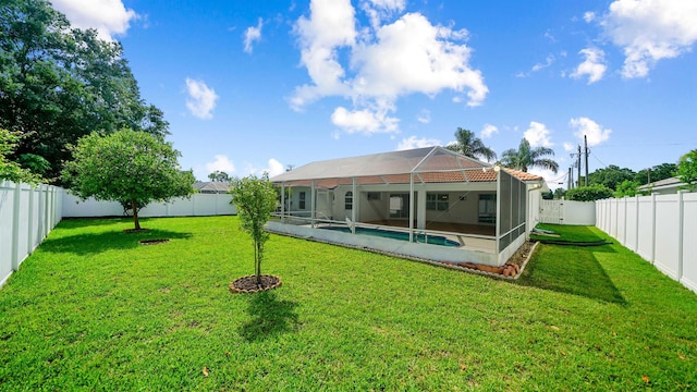 53 Pritchard Dr, Palm Coast, FL 32164 - rear view of property with a fenced backyard and glass enclosure