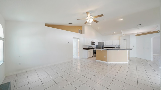 53 Pritchard Dr, Palm Coast, FL 32164 - kitchen with stainless steel appliances, open floor plan, dark countertops, a ceiling fan, and a kitchen island
