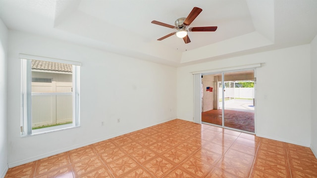 53 Pritchard Dr, Palm Coast, FL 32164 - spare room with a tray ceiling and a ceiling fan