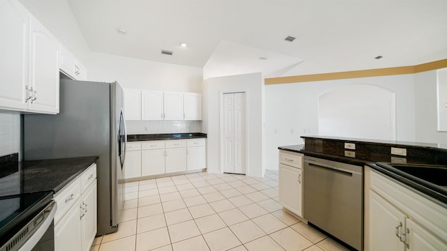 53 Pritchard Dr, Palm Coast, FL 32164 - kitchen featuring dishwasher, decorative backsplash, white cabinets, and light tile patterned floors