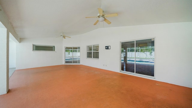 53 Pritchard Dr, Palm Coast, FL 32164 - unfurnished room with vaulted ceiling, carpet, and a ceiling fan