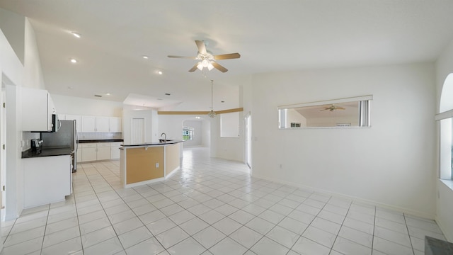 53 Pritchard Dr, Palm Coast, FL 32164 - kitchen with a ceiling fan, dark countertops, backsplash, open floor plan, and light tile patterned floors