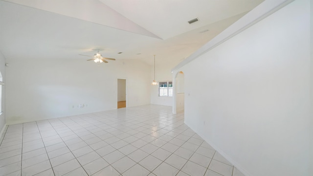 53 Pritchard Dr, Palm Coast, FL 32164 - spare room featuring lofted ceiling, ceiling fan, light tile patterned flooring, and arched walkways