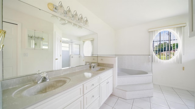 53 Pritchard Dr, Palm Coast, FL 32164 - full bath with a bath, plenty of natural light, double vanity, and tile patterned floors