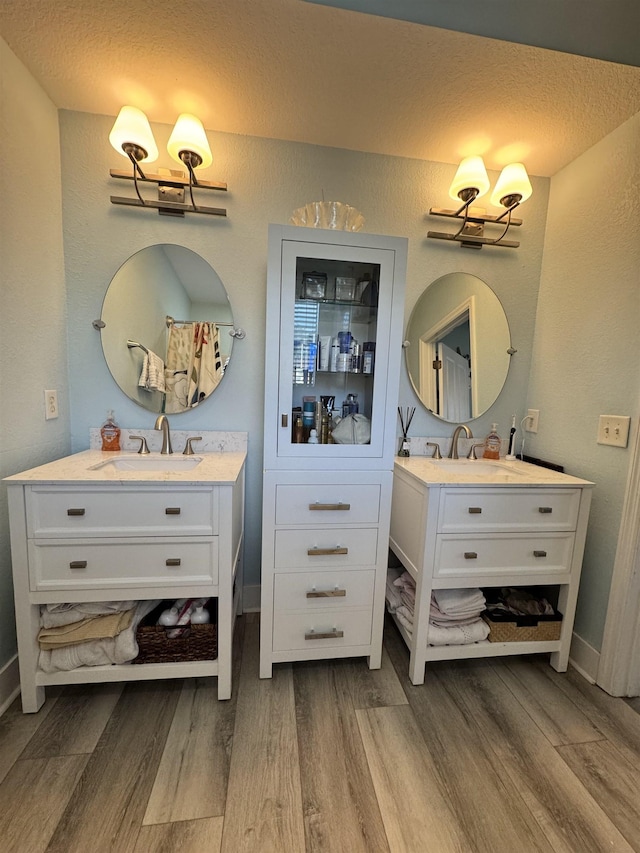 bathroom featuring vanity and hardwood / wood-style floors