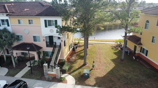 view of home's community featuring a water view