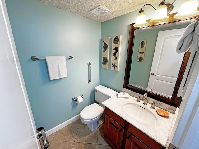 bathroom with a textured ceiling, toilet, visible vents, tile patterned flooring, and vanity