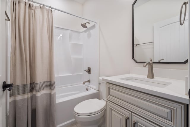 bathroom featuring vanity, toilet, and shower / bathtub combination with curtain