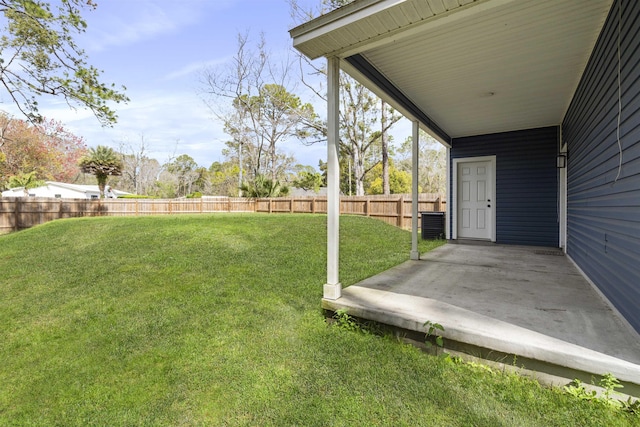 view of yard with a patio area, a fenced backyard, and cooling unit