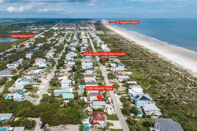 aerial view featuring a water view and a beach view