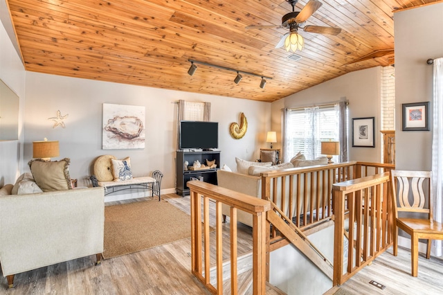 living room featuring ceiling fan, wooden ceiling, light hardwood / wood-style flooring, track lighting, and vaulted ceiling