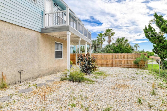 view of yard with a balcony