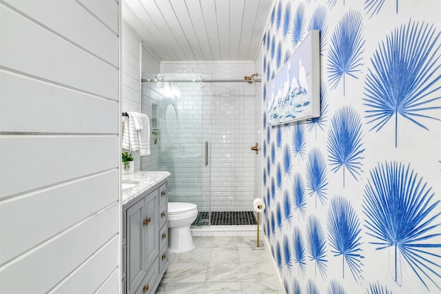 bathroom featuring vanity, toilet, and walk in shower