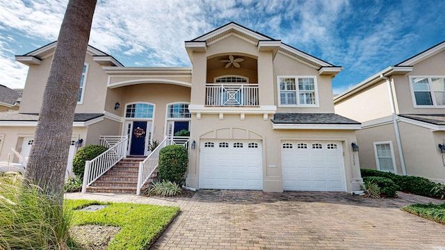 multi unit property with a balcony and a garage