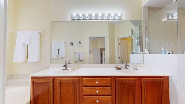 bathroom with independent shower and bath and vanity