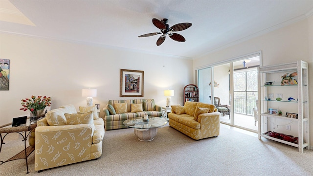 living room featuring carpet floors, ceiling fan, and crown molding